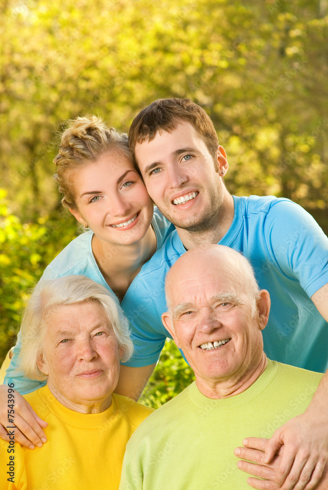 Young couple and their grandparents outdoors Young couple and their grandparents outdoors