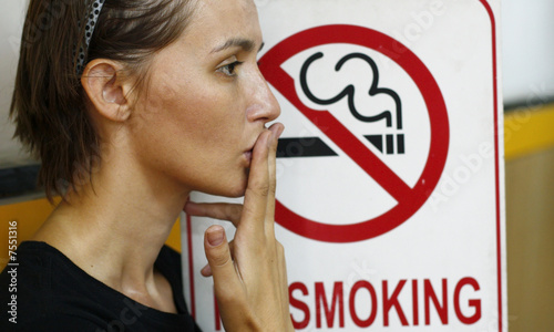 Lady smoking a non-smoking panel