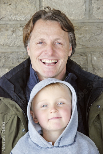 A portrait of a happy smiling father and son. photo