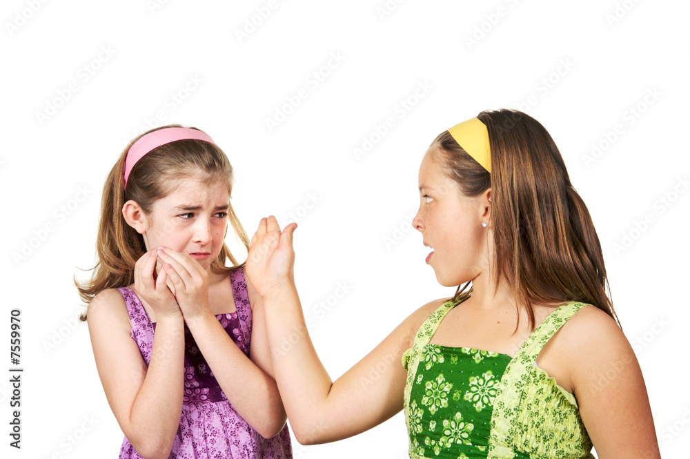 Two young girls fighting one slapping the other and one scared Two young girls fighting one slapping the other and one scared