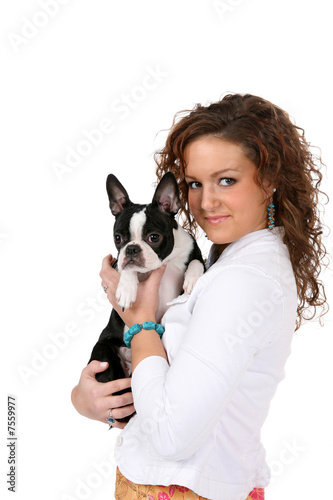 Pretty teenage girl holding a Boston Terrier