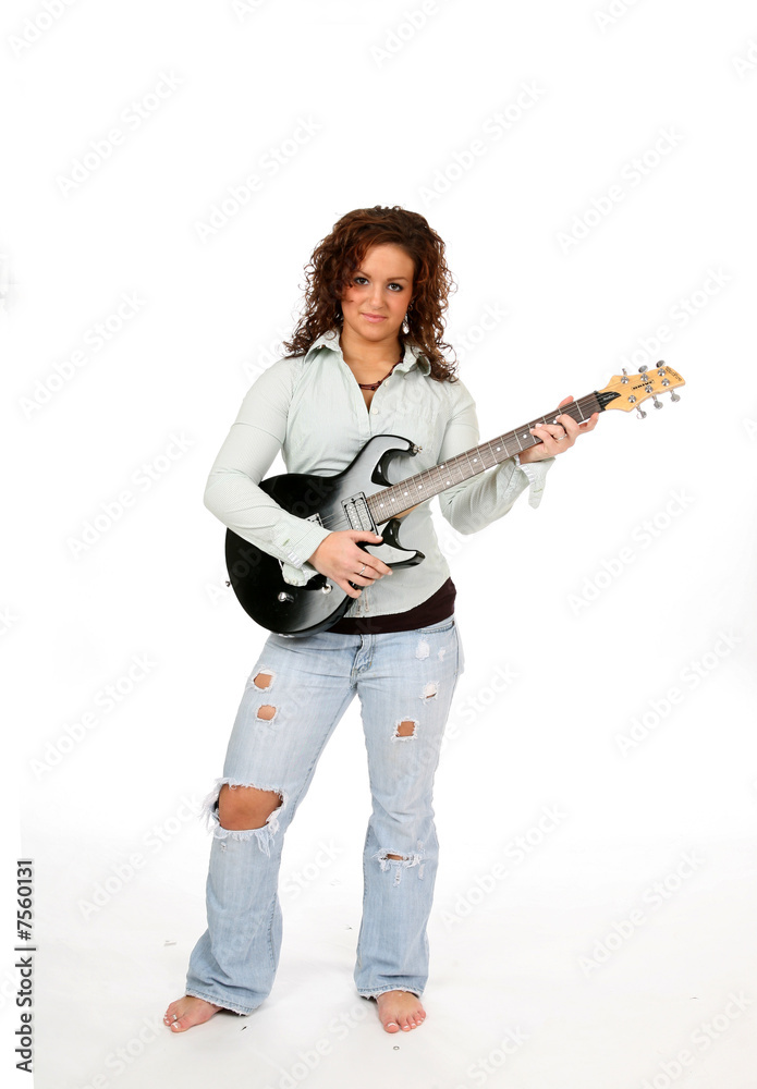 Pretty teen rocker with black electric guitar Pretty teen rocker with black electric guitar
