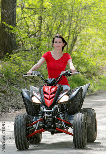 woman in red on four wheeler
