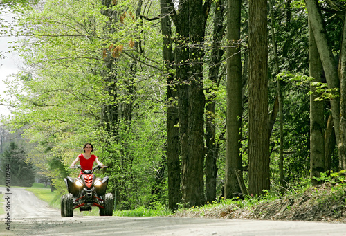 woman in red on four wheeler