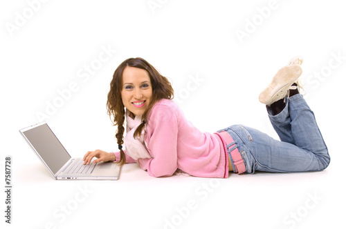 Smiley woman with notebook lying on the floor