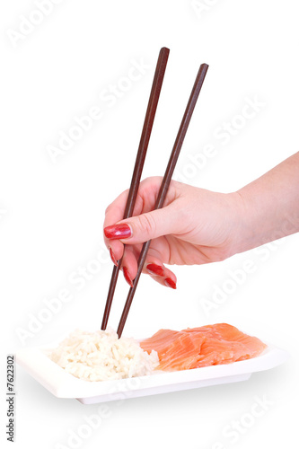 Obraz na płótnie woman's hand with chopsticks w salonie
