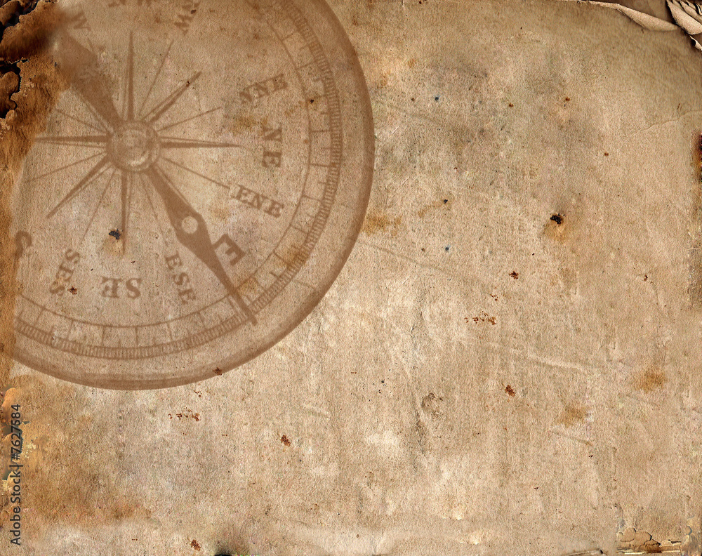 Compass on the old paper