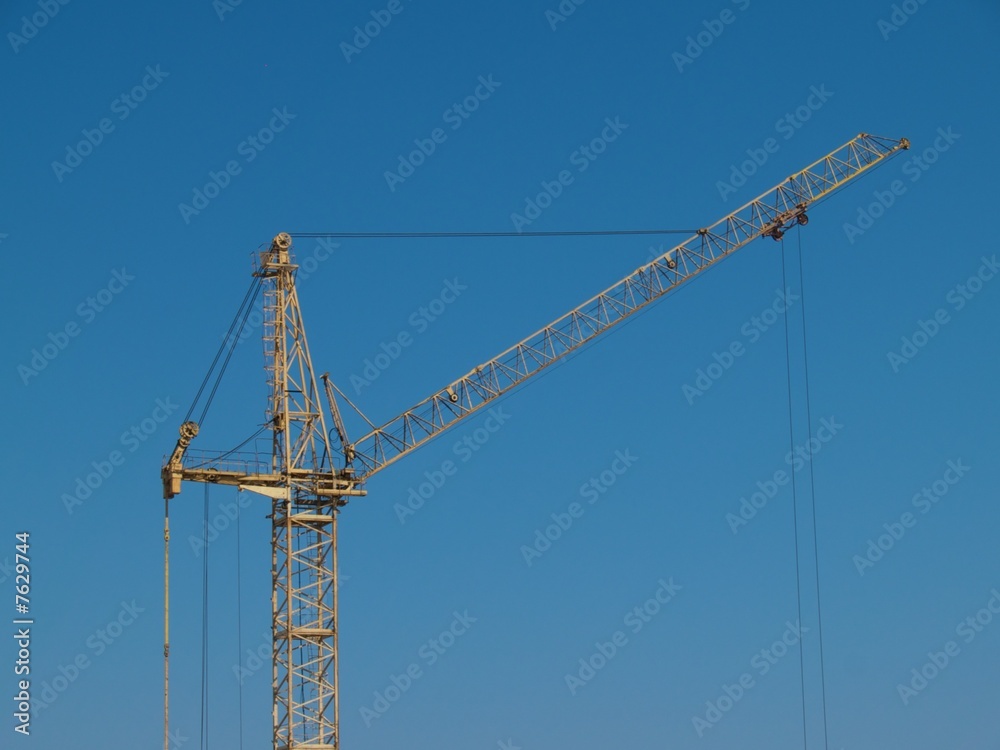 Yellow  crane on blue sky background