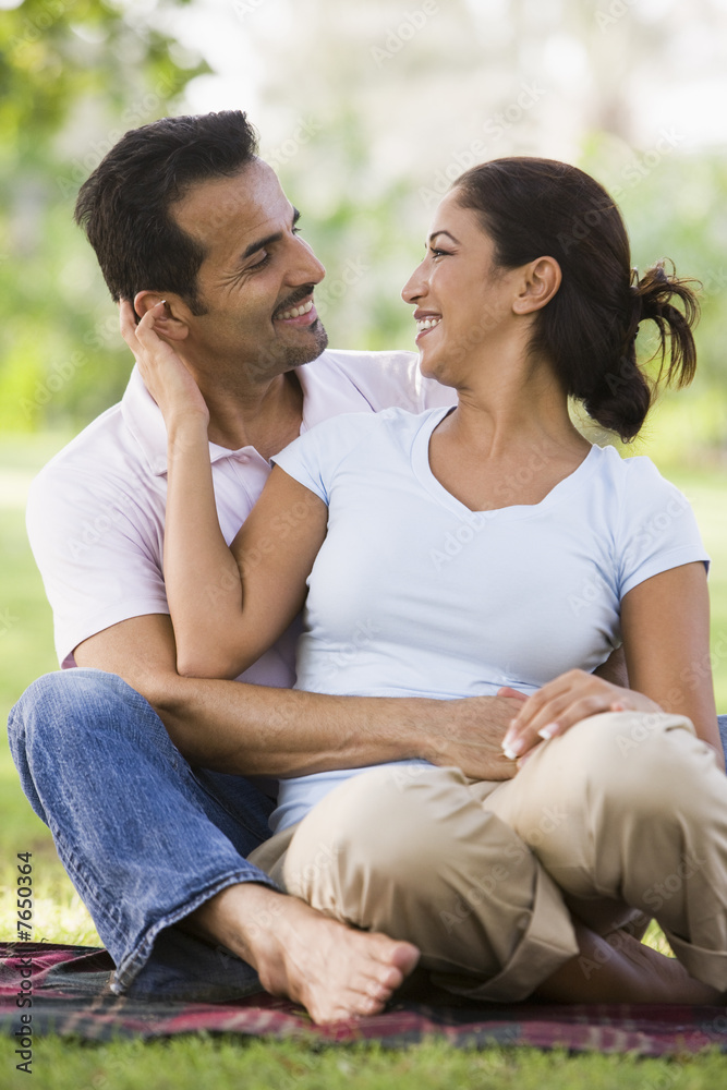 Couple relaxing in park Couple relaxing in park