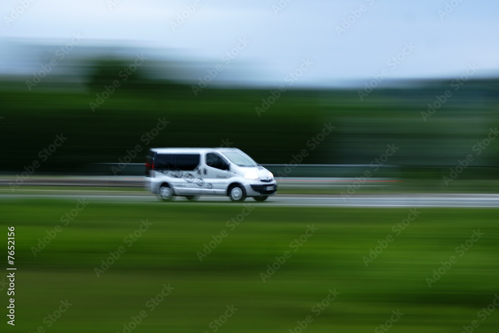 Delivery van moving on road
