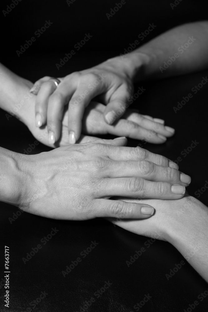 four hands touch