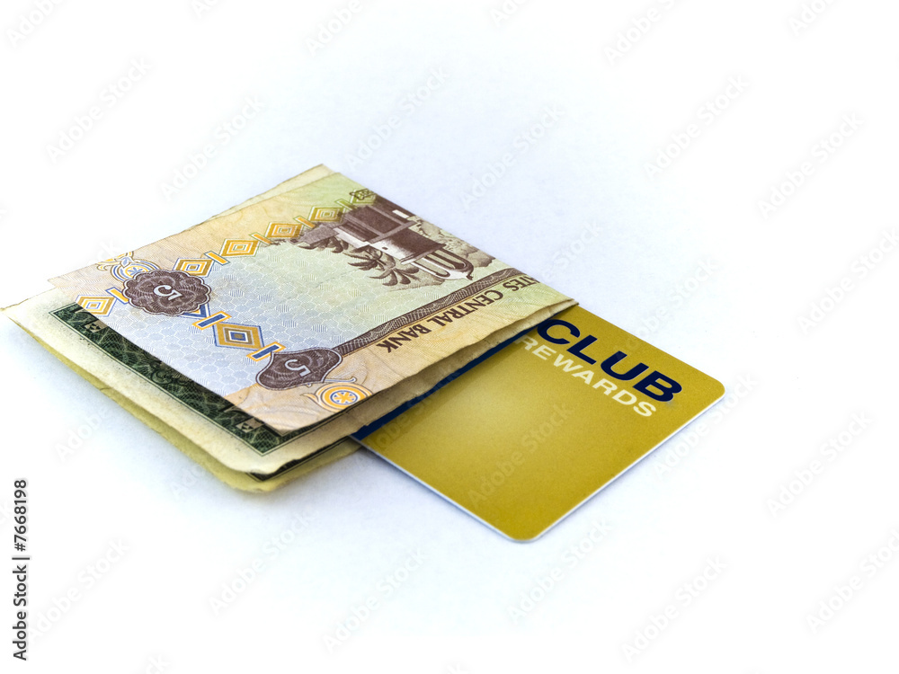 Five Dirham Note and Gold Membership Club Card on White Backgrou Five Dirham Note and Gold Membership Club Card on White Backgrou