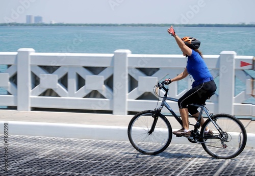 Woman Riding a Ten Speed Bicycle photo