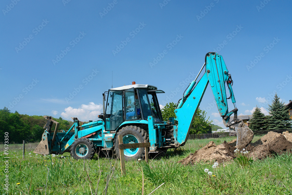 Backhoe loader at work Backhoe loader at work