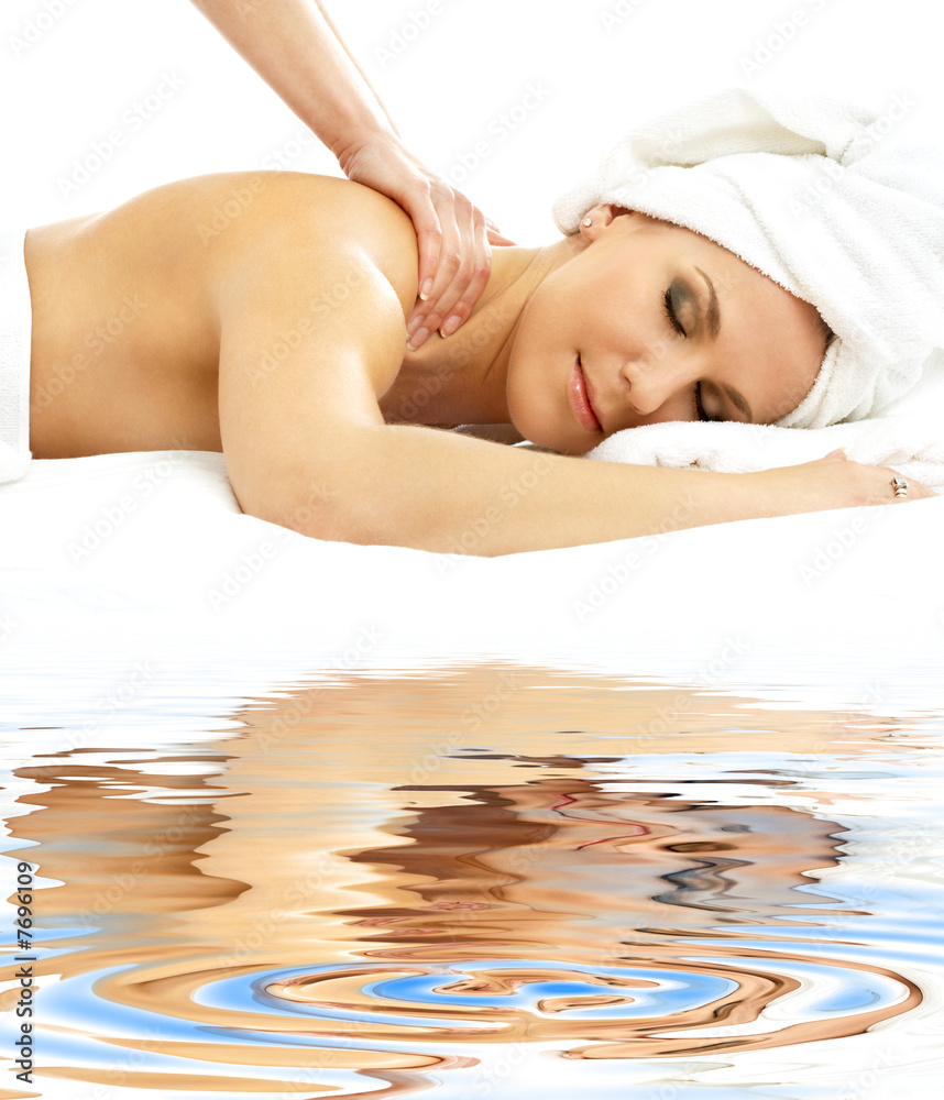 Obraz premium professional massage on white sand