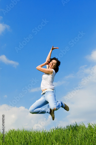 happy young woman is jumping