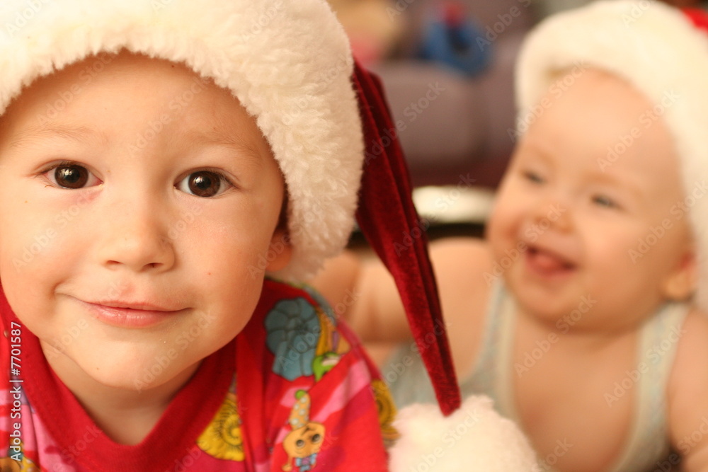 Two children lay on a floor