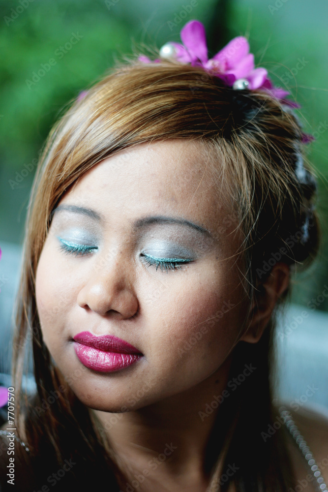 Asian bride with flowers in her hair. Asian bride with flowers in her hair.