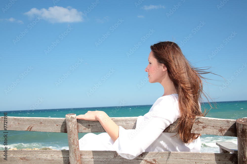 beautiful young woman relaxing on the bench