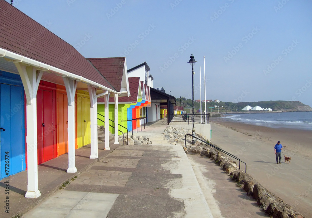 Colorful beach chalets by seaside