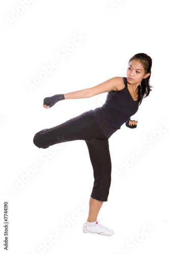 Young fitness female in combat stance 
