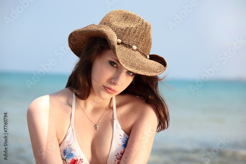 beautiful teen girl in swimwear and cowboy hat