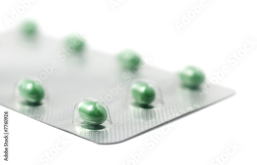 Green Pills Foil Packaged on White