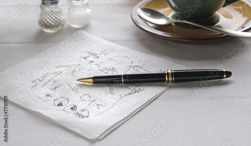 Napkin with Scribbled Notes and Pen on Table