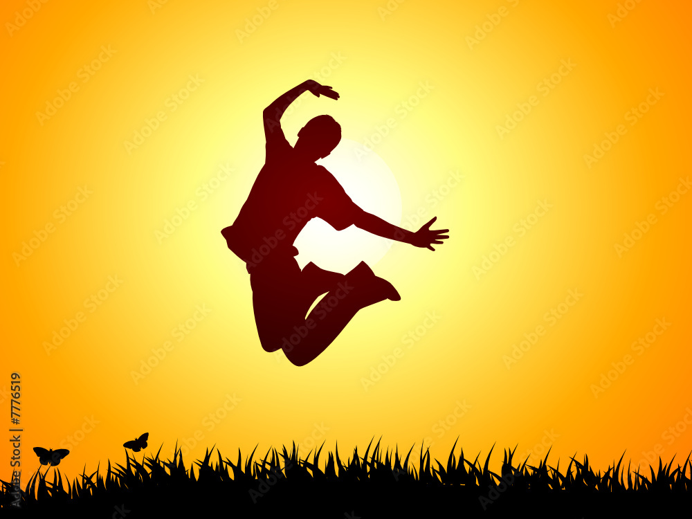 Boy jumping ati sunset