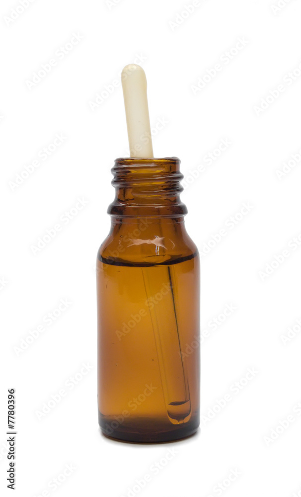Dropper in jar isolated on white Dropper in jar isolated on white