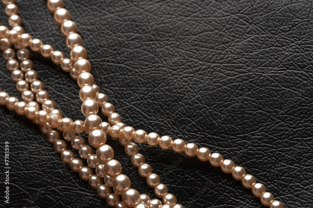 pearls on black leather