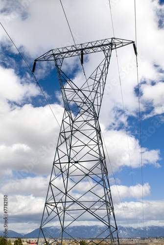 Power Tower Over Town and Mountain Range
