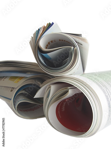Rolled newspaper isolated on white