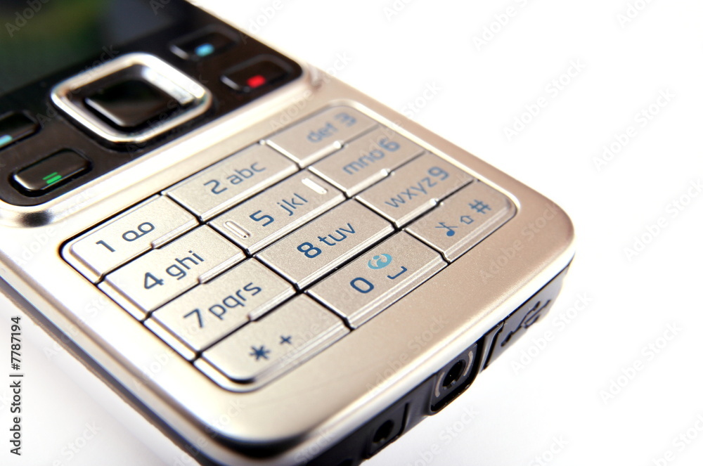 Modern silver mobile phone close-up isolated Modern silver mobile phone close-up isolated