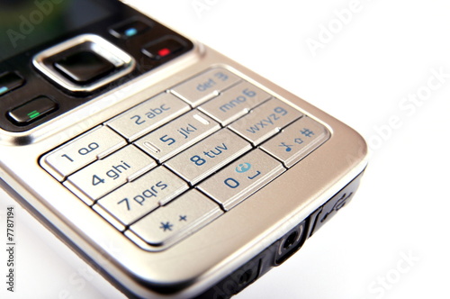 Modern silver mobile phone close-up isolated