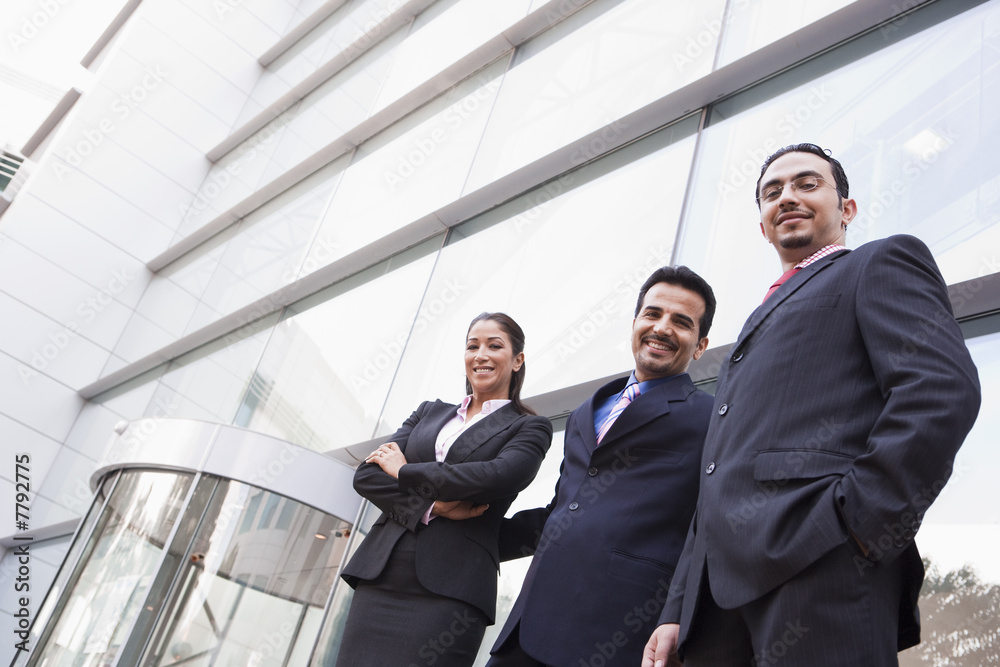 Group of business people outside office building Group of business people outside office building