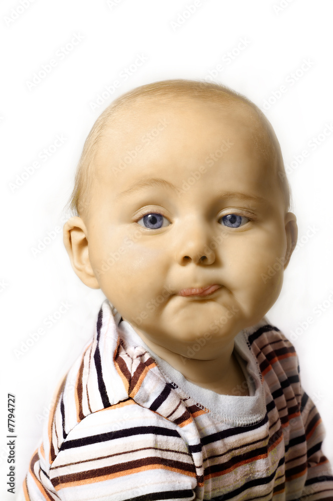 Cute six month old baby with humorous expression. Cute six month old baby with humorous expression.