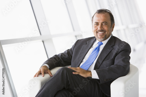 Businessman relaxing in lobby
