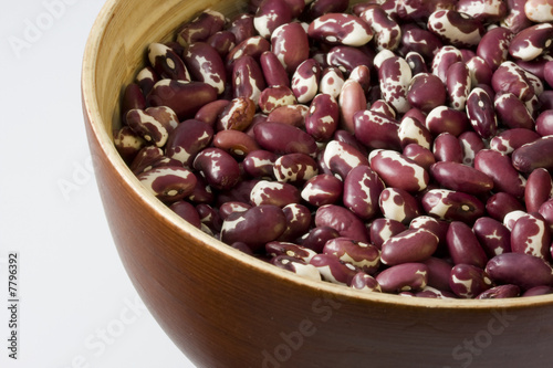 wooden, round bowl of anasazi beans photo