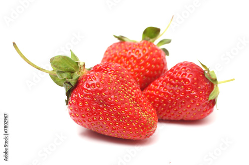 Obraz na płótnie Three berry of a strawberry w salonie