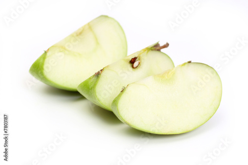 Obraz na płótnie Three slice a green apple w salonie