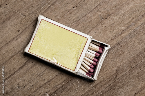 Matchbox on old table.