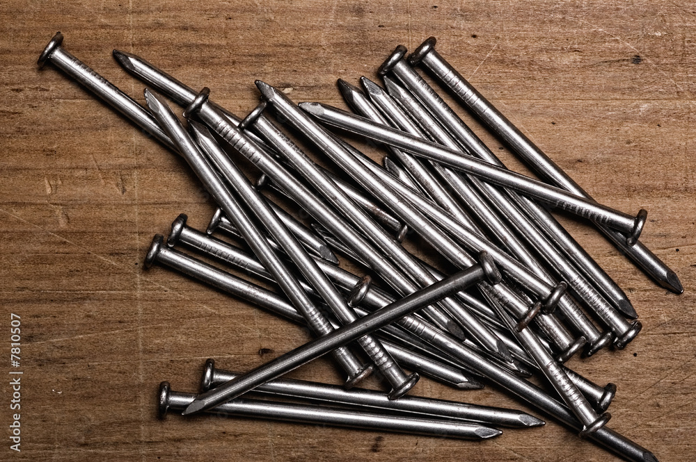 Nails on wooden table.