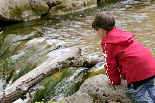boy playing in the river