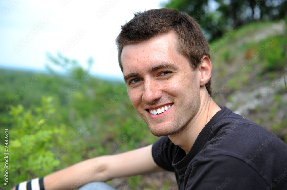Portrait of the beautiful young man of the outdoors