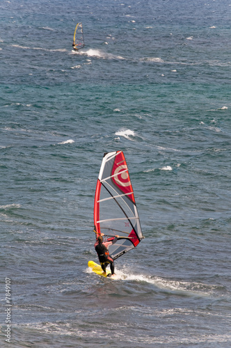 Windsurfer sufing on the sea of beach Pozo Izquierdo. Gran Canar photo