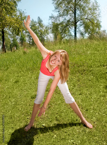 Young girl working out in the park