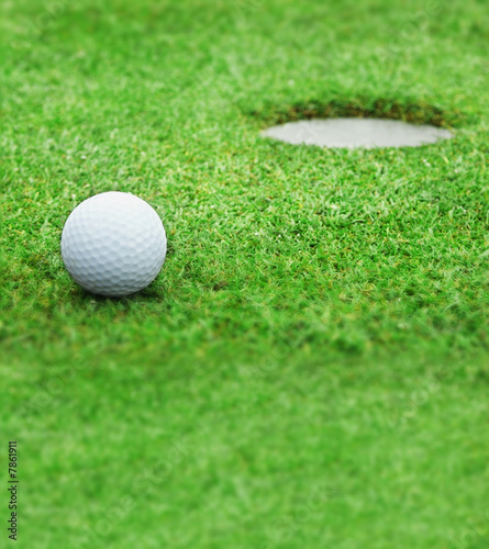 Golf - detail ball with hole on green