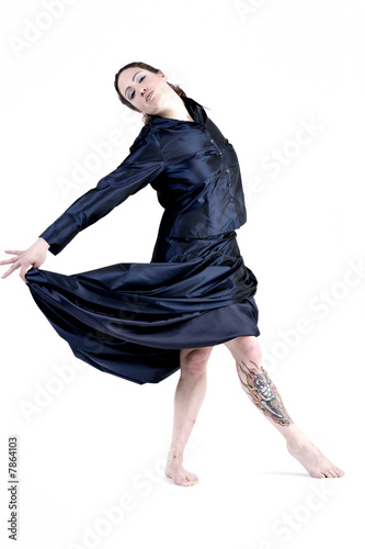 Woman with long curly hair in a gala dress photo