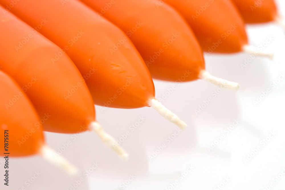 New orange candles in a diagonal row - Close-up